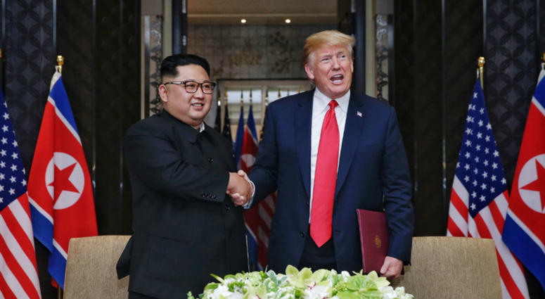 Top leader of the Democratic People's Republic of Korea (DPRK) Kim Jong Un (L) shakes hands with U.S. President Donald Trump during the signing ceremony of a joint statement in Singapore on June 12, 2018. Kim Jong Un shakes hands with Donald Trump