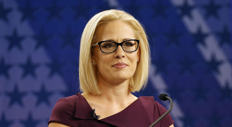 In this Oct. 15, 2018 file photo, U.S. Rep. Kyrsten Sinema, D-Ariz., goes over the rules in a television studio prior to a televised debate with U.S. Rep. Martha McSally, R-Ariz., in Phoenix. In this Oct. 15, 2018 file photo, U.S. Rep. Kyrsten Sinema, D-Ariz., goes over the rules in a television studio prior to a televised debate with U.S. Rep. Martha McSally, R-Ariz., in Phoenix.