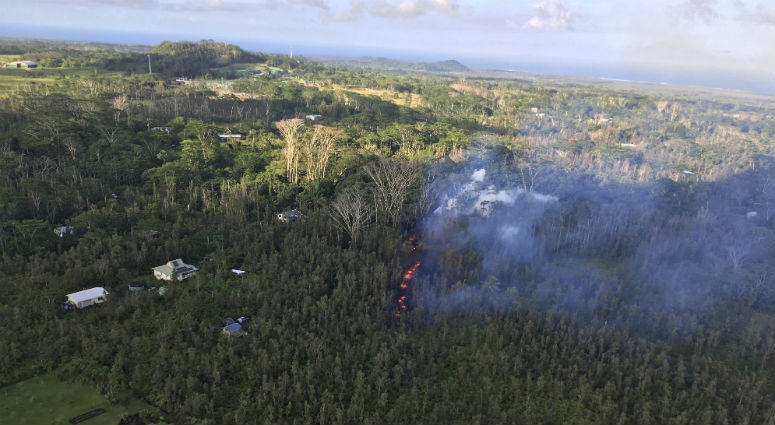 In this photo released by U.S. Geological Survey, lava is shown burning in Leilani Estates subdivision near the town of Pahoa on the Big Island in Hawaii Volcanoes National Park Thursday, May 3, 2018. lava is shown burning in Leilani Estates subdivision near the town of Pahoa on the Big Island in Hawaii