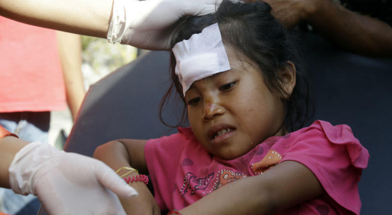 A girl injured in an earthquake is treated in Mataram, Lombok, Indonesia, Thursday, Aug. 9, 2018. The Indonesian island of Lombok was shaken by a third big earthquake in little more than a week Thursday. A girl injured in an earthquake is treated in Mataram, Lombok, Indonesia, Thursday, Aug. 9, 2018. The Indonesian island of Lombok was shaken by a third big earthquake in little more than a week Thursday.