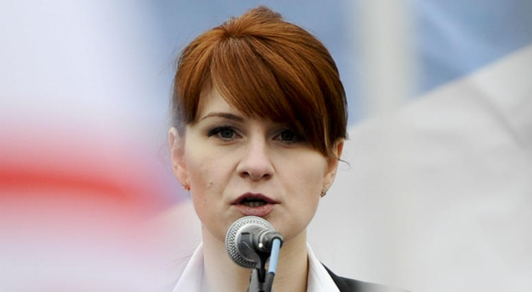 In this photo taken on Sunday, April 21, 2013, Maria Butina, leader of a pro-gun organization in Russia, speaks to a crowd during a rally in support of legalizing the possession of handguns in Moscow, Russia. In this photo taken on Sunday, April 21, 2013, Maria Butina, leader of a pro-gun organization in Russia, speaks to a crowd during a rally in support of legalizing the possession of handguns in Moscow, Russia.
