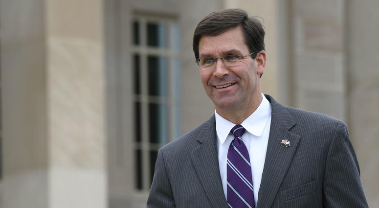 In this July 8, 2019, photo, acting Secretary of Defense Mark Esper waits for the arrival of Qatar's Emir Sheikh Tamim bin Hamad Al Thani to the Pentagon. In this July 8, 2019, photo, acting Secretary of Defense Mark Esper waits for the arrival of Qatar's Emir Sheikh Tamim bin Hamad Al Thani to the Pentagon.