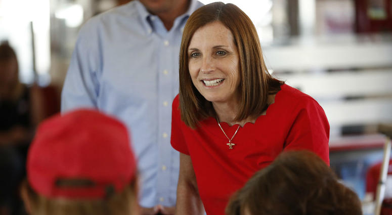 In this Nov. 6, 2018, file photo, Arizona Republican senatorial candidate Martha McSally, speaks with voters, at Chase's diner in Chandler, Ariz. In this Nov. 6, 2018, file photo, Arizona Republican senatorial candidate Martha McSally, speaks with voters, at Chase's diner in Chandler, Ariz.