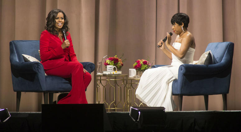 Former first lady Michelle Obama, left, is interviewed by Phoebe Robinson during the "Becoming: An Intimate Conversation with Michelle Obama" event at the Wells Fargo Center on Thursday, Nov. 29, 2018, in Philadelphia. Former first lady Michelle Obama, left, is interviewed by Phoebe Robinson during the "Becoming: An Intimate Conversation with Michelle Obama" event at the Wells Fargo Center on Thursday, Nov. 29, 2018, in Philadelphia.