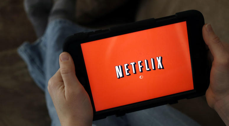In this Friday, Jan. 17, 2014, file photo, a person displays Netflix on a tablet in North Andover, Mass. In this Friday, Jan. 17, 2014, file photo, a person displays Netflix on a tablet in North Andover, Mass.