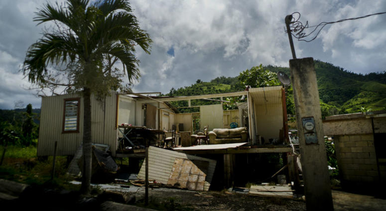 In this Sept. 8, 2018 photo, a home that was abandoned after Hurricane Maria hit one year ago stands full of furniture in the San Lorenzo neighborhood of Morovis, Puerto Rico. In this Sept. 8, 2018 photo, a home that was abandoned after Hurricane Maria hit one year ago stands full of furniture in the San Lorenzo neighborhood of Morovis, Puerto Rico.
