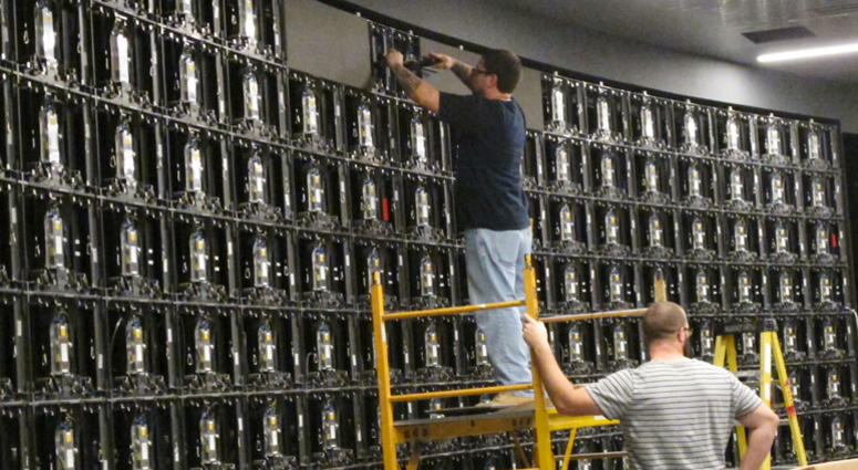 In this Nov. 13, 2018, photo, workers prepare to install gigantic video screens at Resorts Casino in Atlantic City N.J., in the casino's new sports betting facility it will open with DraftKings on Nov. 20. In this Nov. 13, 2018, photo, workers prepare to install gigantic video screens at Resorts Casino in Atlantic City N.J., in the casino's new sports betting facility it will open with DraftKings on Nov. 20.