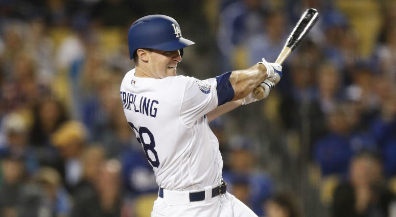 Los Angeles Dodgers starting pitcher Ross Stripling follows through on an RBI single during the fifth inning against the Philadelphia Phillies in a baseball game Wednesday, May 30, 2018, in Los Angeles. Los Angeles Dodgers starting pitcher Ross Stripling