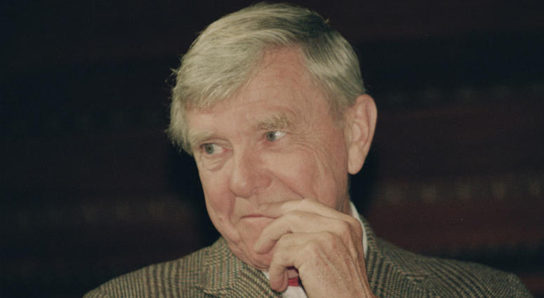 In this Tuesday, Feb. 23, 1993 file photo, writer Russell Baker, ponders a reporter's question during a New York news conference where he was presented as the successor to host Alistair Cooke for the PBS series "Masterpiece Theatre." In this Tuesday, Feb. 23, 1993 file photo, writer Russell Baker, ponders a reporter's question during a New York news conference where he was presented as the successor to host Alistair Cooke for the PBS series "Masterpiece Theatre."