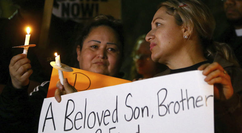 Sandra Gonzalez, left, mother of slain 14-year-old boy shot by Tempe Police, joins protesters in front of police headquarters Thursday, Jan. 17, 2019, in Tempe, Ariz. Sandra Gonzalez, left, mother of slain 14-year-old boy shot by Tempe Police, joins protesters in front of police headquarters Thursday, Jan. 17, 2019, in Tempe, Ariz.