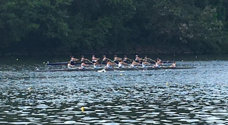 A crew team rows on the Schuylkill River. A crew team rows on the Schuylkill River.