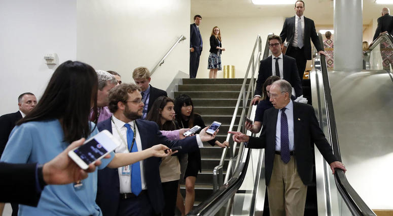 Senate Judiciary Committee Chairman Chuck Grassley, R-Iowa, talks with reporters as he uses the escalator on Capitol Hill, Wednesday, Oct. 3, 2018 in Washington. Senate Judiciary Committee Chairman Chuck Grassley, R-Iowa, talks with reporters as he uses the escalator on Capitol Hill, Wednesday, Oct. 3, 2018 in Washington.