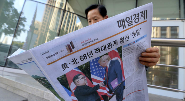 A man reads a newspaper reporting the summit between U.S. President Donald Trump and North Korean leader Kim Jong Un, at a newspaper distributing station in Seoul, South Korea, Tuesday, June 12, 2018. A man reads a newspaper reporting the summit between U.S. President Donald Trump and North Korean leader Kim Jong Un, at a newspaper distributing station in Seoul, South Korea, Tuesday, June 12, 2018.