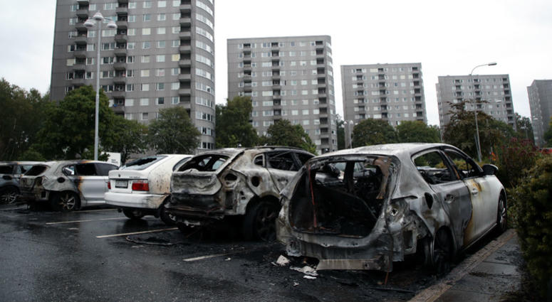 Burned cars parked at Frolunda Square in Gothenburg, Tuesday, Aug. 14, 2018. Burned cars parked at Frolunda Square in Gothenburg, Tuesday, Aug. 14, 2018.