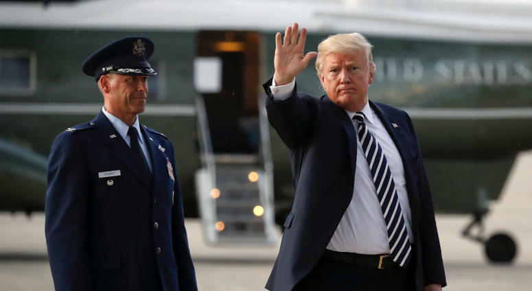 President Donald Trump waves to members of the media after arriving on Air Force One, Friday, Aug. 31, 2018 at Andrews Air Force Base in Md. Watching is Air Force Col. Samuel Chesnut. President Donald Trump waves to members of the media after arriving on Air Force One, Friday, Aug. 31, 2018 at Andrews Air Force Base in Md. Watching is Air Force Col. Samuel Chesnut.