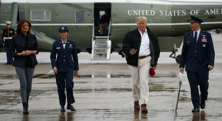 President Donald Trump and first lady Melania Trump board Air Force One for a trip to visit areas affected by Hurricane Michael, Monday, Oct. 15, 2018, in Andrews Air Force Base, Md. President Donald Trump and first lady Melania Trump board Air Force One for a trip to visit areas affected by Hurricane Michael, Monday, Oct. 15, 2018, in Andrews Air Force Base, Md.