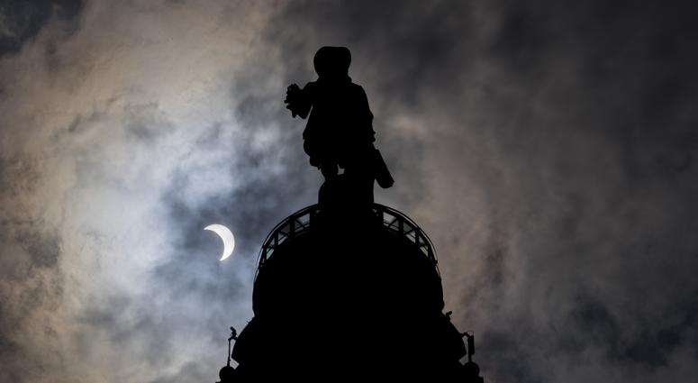 Aug 21, 2017; Philadelphia, PA, USA; A general view of the William Penn statue atop City Hall during the 2017 partial solar eclipse in Philadelphia, PA. Aug 21, 2017; Philadelphia, PA, USA; A general view of the William Penn statue atop City Hall during the 2017 partial solar eclipse in Philadelphia, PA.