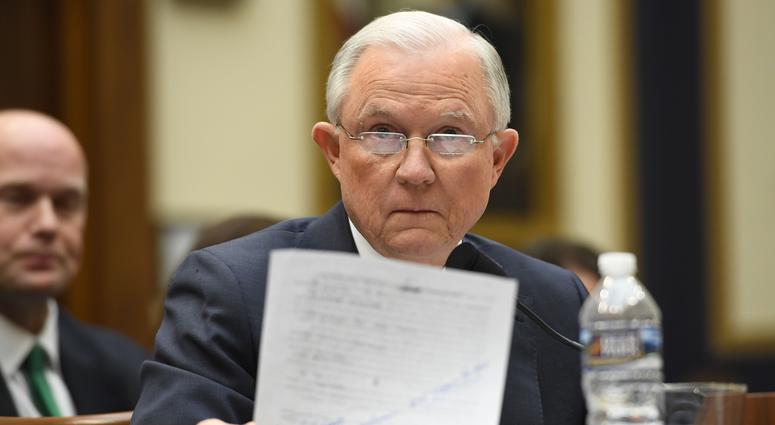 Attorney General Jeff Sessions holds a sheet of paper containing text related to questioning by Sen. Al Frankenfrom Sessions' confirmation hearing in 2017 before the House Judiciary Committee during an oversight hearing on the Department of Justice. Attorney General Jeff Sessions holds a sheet of paper containing text related to questioning by Sen. Al Frankenfrom Sessions' confirmation hearing in 2017 before the House Judiciary Committee during an oversight hearing on the Department of Justice.