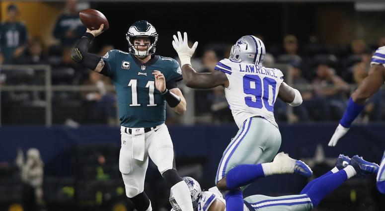 Philadelphia Eagles quarterback Carson Wentz (11) throws a pass against Dallas Cowboys defensive end DeMarcus Lawrence (90) in the fourth quarter at AT&T Stadium. eagles/cowboys