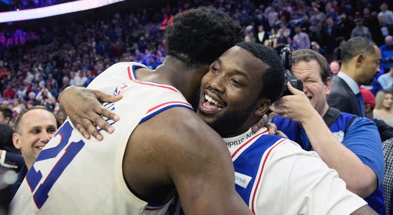 Philadelphia 76ers center Joel Embiid hugs rapper Meek Mill after a victory against the Miami Heat. Philadelphia 76ers center Joel Embiid hugs rapper Meek Mill after a victory against the Miami Heat.