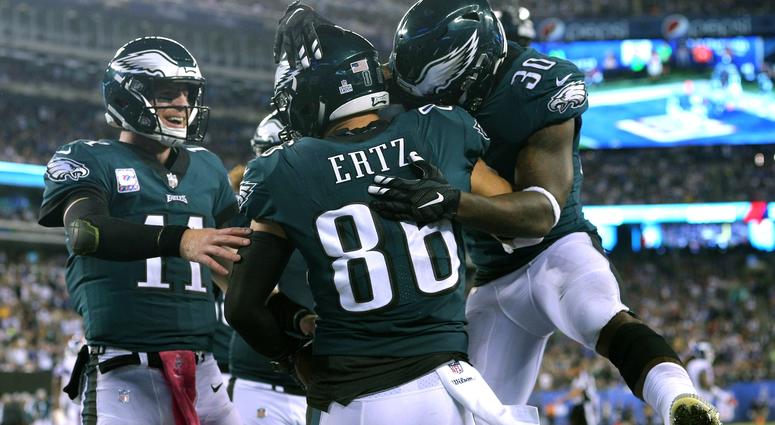 Philadelphia Eagles tight end Zach Ertz (86) celebrates with quarterback Carson Wentz (11) and running back Corey Clement (30) after making a touchdown catch against the New York Giants during the second quarter at MetLife Stadium, Oct. 11, 2018. Philadelphia Eagles tight end Zach Ertz (86) celebrates with quarterback Carson Wentz (11) and running back Corey Clement (30) after making a touchdown catch against the New York Giants during the second quarter at MetLife Stadium, Oct. 11, 2018.