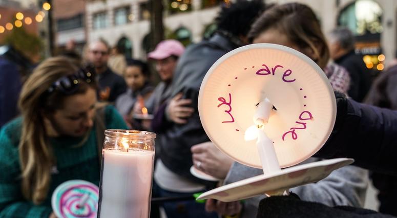 Community members light candles while coming together during a vigil for the shooting victims killed inside the Tree of Life synagogue in Pittsburgh on Monday, October 29, 2018 at Capitol Park in downtown Detroit. Community members light candles while coming together during a vigil for the shooting victims killed inside the Tree of Life synagogue in Pittsburgh on Monday, October 29, 2018 at Capitol Park in downtown Detroit.
