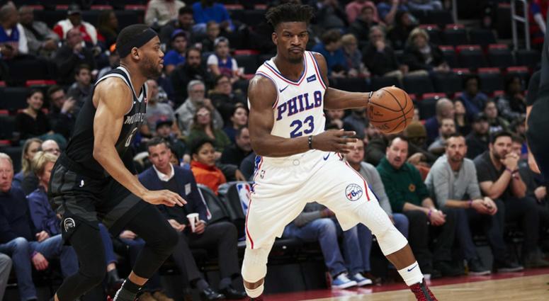 Philadelphia 76ers guard Jimmy Butler (23) dribbles defended by Detroit Pistons guard Bruce Brown (6) in the first half at Little Caesars Arena. Jimmy Butler