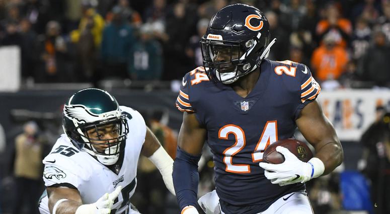 Chicago Bears running back Jordan Howard (24) runs the ball against Philadelphia Eagles defensive end Brandon Graham (55) in the first half of a NFC Wild Card playoff football game at Soldier Field, Jan. 6, 2019. Chicago Bears versus Philadelphia Eagles