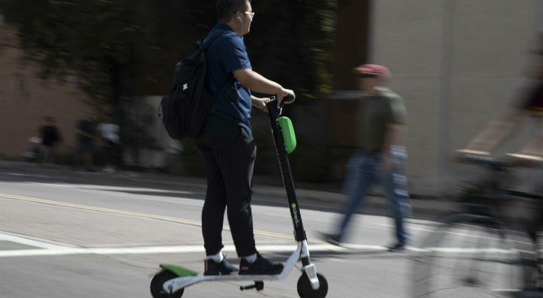 A man rides a scooter Oct. 4, 2018, in Tempe. A man rides a scooter Oct. 4, 2018, in Tempe.