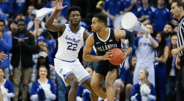 Mar 9, 2019; Newark, NJ, USA; Villanova Wildcats guard Phil Booth (5) shields the ball from Seton Hall Pirates guard Myles Cale (22) during the seance half at Prudential Center. Mar 9, 2019; Newark, NJ, USA; Villanova Wildcats guard Phil Booth (5) shields the ball from Seton Hall Pirates guard Myles Cale (22) during the seance half at Prudential Center.