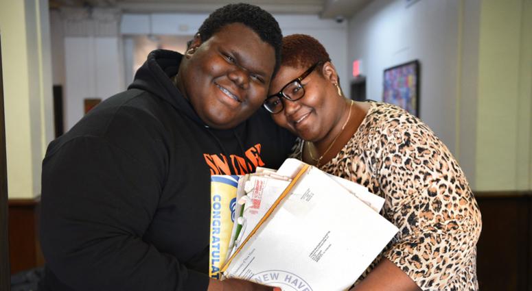 Formerly homeless student Dylan Chidick of Jersey City, NJ and his mother Khadine Phillip, hold his seventeen acceptance letters from college. Dylan Chidick of Jersey City, NJ and his mother Khadine Phillip hold his seventeen acceptance letters from college.