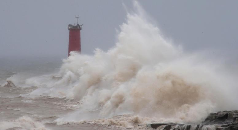Strong winds whipped waves against the Sheboygan north pier breakwater, Saturday, April 14, 2018, in Sheboygan, Wis. Strong winds whipped waves against the Sheboygan north pier breakwater, Saturday, April 14, 2018, in Sheboygan, Wis.