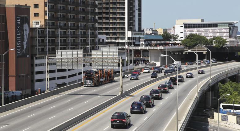 The funeral procession for Muhammad Ali heads west on I-64 outside the KFC Yum! Center prior to his public memorial service on June 10, 2016. The funeral procession for Muhammad Ali