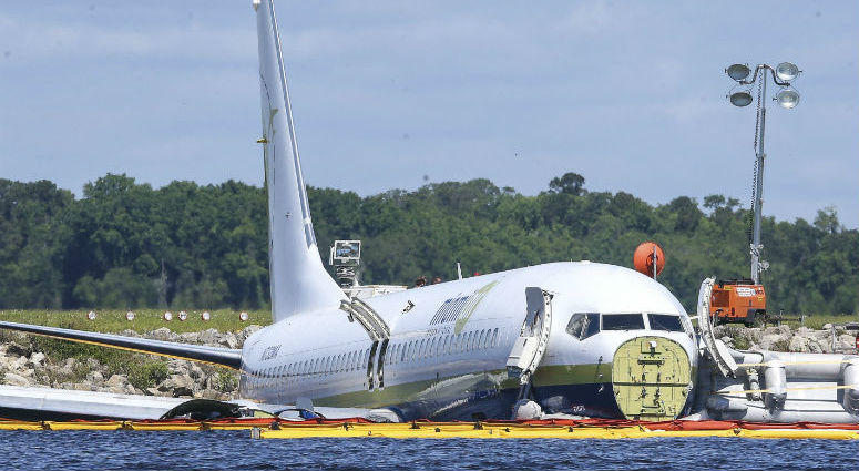 A charter plane carrying 143 people and traveling from Cuba to north Florida sits in a river at the end of a runway, Saturday, May 4, 2019 in Jacksonville, Fla. A charter plane carrying 143 people and traveling from Cuba to north Florida sits in a river at the end of a runway, Saturday, May 4, 2019 in Jacksonville, Fla.