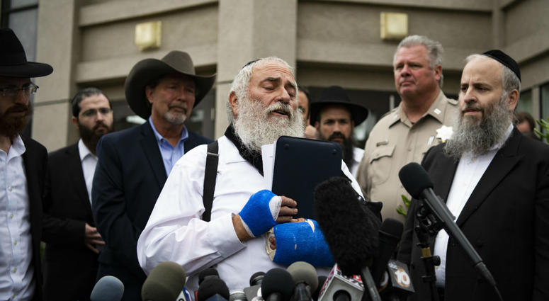 Rabbi Yisroel Goldstein speaks during a press conference in front of Chabad of Poway synagogue. Rabbi Yisroel Goldstein speaks during a press conference in front of Chabad of Poway synagogue.