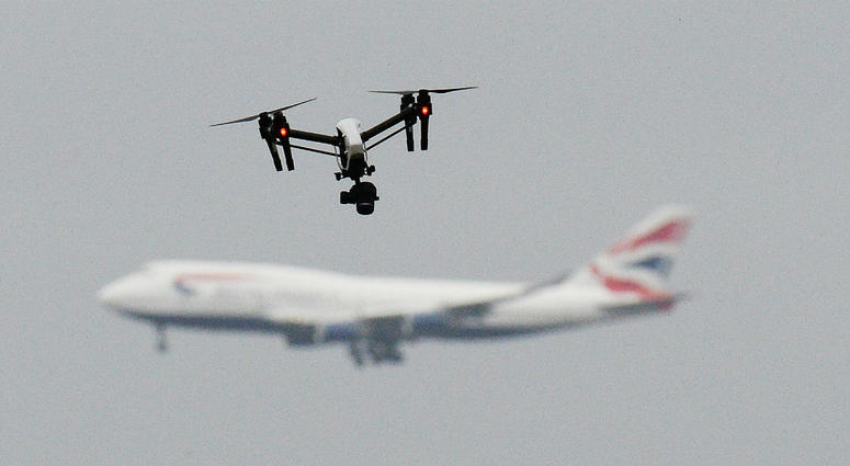 File photo dated 25/2/2017 of a drone and an aircraft. Gatwick airport remains closed this morning after drones were spotted over the airfield last night and this morning. File photo dated 25/2/2017 of a drone and an aircraft.