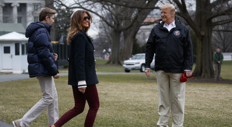 In this March 8, 2019 file photo, President Donald Trump waits for his son Barron Trump, and first lady Melania Trump after speaking with reporters before traveling to Alabama to visit areas affected by the deadly tornadoes. In this March 8, 2019 file photo, President Donald Trump waits for his son Barron Trump, and first lady Melania Trump after speaking with reporters before traveling to Alabama to visit areas affected by the deadly tornadoes.