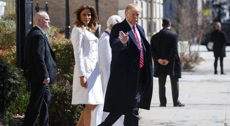 President Donald Trump and first lady Melania Trump, with Reverend Bruce McPherson, walk to their motorcade after attending service at Saint John's Church in Washington, Sunday, March 17, 2019, en route to the White House. ( President Donald Trump and first lady Melania Trump, with Reverend Bruce McPherson, walk to their motorcade after attending service at Saint John's Church in Washington, Sunday, March 17, 2019, en route to the White House. (