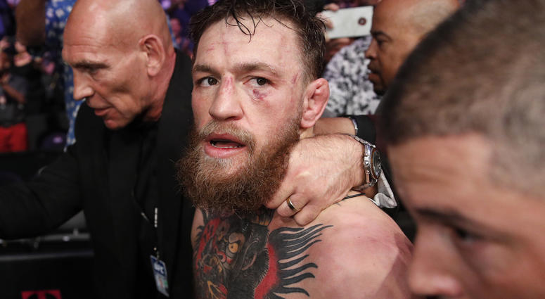 In this Oct. 6, 2018, file photo, Conor McGregor walks out of the arena after he was defeated by Khabib Nurmagomedov in a lightweight title mixed martial arts bout at UFC 229 in Las Vegas. In this Oct. 6, 2018, file photo, Conor McGregor walks out of the arena after he was defeated by Khabib Nurmagomedov in a lightweight title mixed martial arts bout at UFC 229 in Las Vegas.
