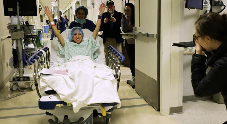 In this image made from video provided by Johns Hopkins Medicine, Nina Martinez of Atlanta is wheeled into a Baltimore operating room to become who is thought to be the world’s first kidney transplant living donor with HIV, on Monday, March 25, 2019. In this image made from video provided by Johns Hopkins Medicine, Nina Martinez of Atlanta is wheeled into a Baltimore operating room to become who is thought to be the world’s first kidney transplant living donor with HIV, on Monday, March 25, 2019.