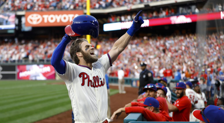 Philadelphia Phillies' Bryce Harper celebrates after hitting a home run off Atlanta Braves relief pitcher Jesse Biddle during the seventh inning of a baseball game, Saturday, March 30, 2019, in Philadelphia. Philadelphia Phillies' Bryce Harper celebrates after hitting a home run off Atlanta Braves relief pitcher Jesse Biddle during the seventh inning of a baseball game, Saturday, March 30, 2019, in Philadelphia.
