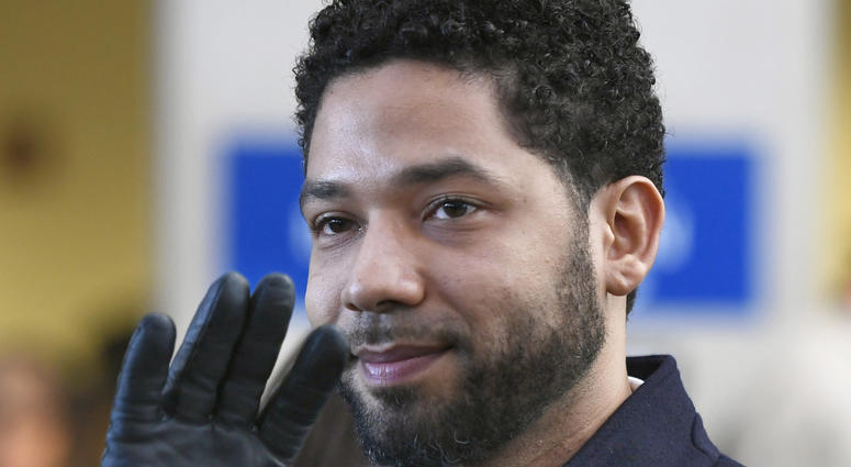 FILE - In this March 26, 2019, file photo, actor Jussie Smollett smiles and waves to supporters before leaving Cook County Court after his charges were dropped in Chicago. A deadline is looming for Smollett to pay over $130,000 to Chicago to cover part of FILE - In this March 26, 2019, file photo, actor Jussie Smollett smiles and waves to supporters before leaving Cook County Court after his charges were dropped in Chicago. A deadline is looming for Smollett to pay over $130,000 to Chicago to cover part of