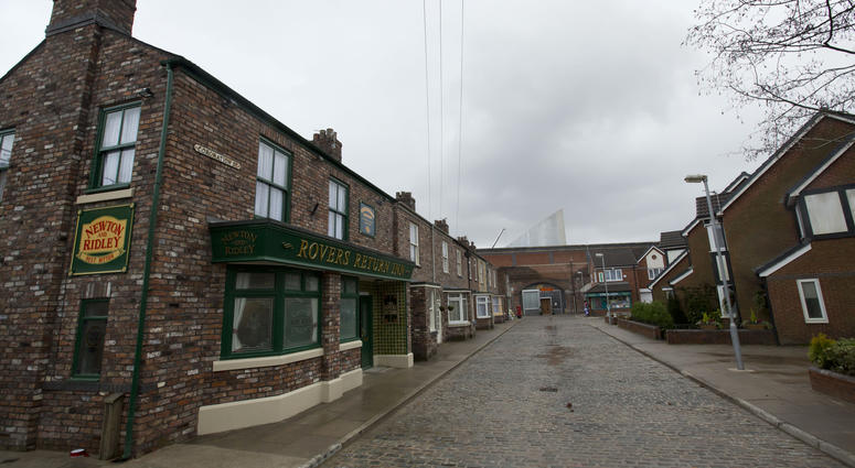 FILE - In this file photo dated Friday, Nov. 29, 2013, the film set of long running British soap opera entitled 'Coronation Street', in Manchester, England. The long running TV series covering an intimate look into the lives of families in the fictional n FILE - In this file photo dated Friday, Nov. 29, 2013, the film set of long running British soap opera entitled 'Coronation Street', in Manchester, England. The long running TV series covering an intimate look into the lives of families in the fictional n