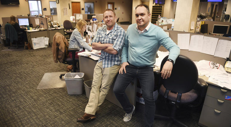 In this April 9, 2019, photo, Argus Leader investigative reporter Jonathan Ellis and news director Cory Myers in the newsroom in Sioux Falls, S.D. In 2010, reporters at South Dakota’s Argus Leader newspaper came up with the idea of requesting data about In this April 9, 2019, photo, Argus Leader investigative reporter Jonathan Ellis and news director Cory Myers in the newsroom in Sioux Falls, S.D. In 2010, reporters at South Dakota’s Argus Leader newspaper came up with the idea of requesting data about