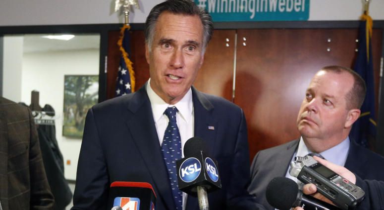 FILE - In this Friday Jan., 18, 2019 file photo, Utah Sen. Mitt Romney, left, speaks with reporters after visiting with local officials to discuss how the four-week partial government shutdown is impacting an area with several major federal employers, in FILE - In this Friday Jan., 18, 2019 file photo, Utah Sen. Mitt Romney, left, speaks with reporters after visiting with local officials to discuss how the four-week partial government shutdown is impacting an area with several major federal employers, in