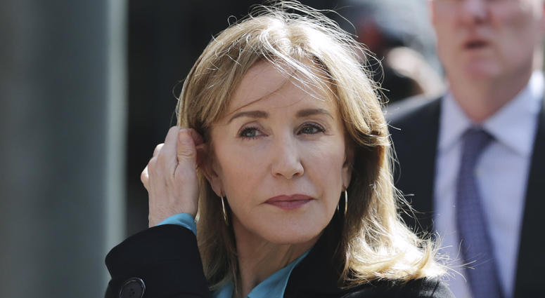 FILE - In this April 3, 2019 file photo, actress Felicity Huffman arrives at federal court in Boston to face charges in a nationwide college admissions bribery scandal. FILE - In this April 3, 2019 file photo, actress Felicity Huffman arrives at federal court in Boston to face charges in a nationwide college admissions bribery scandal.