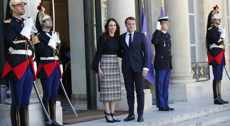 New Zealand Prime Minister Jacinda Ardern, center left, is greeted by French President Emmanuel Macron, center right, as she arrives at the Elysee Palace, in Paris, Wednesday, May 15, 2019. New Zealand Prime Minister Jacinda Ardern, center left, is greeted by French President Emmanuel Macron, center right, as she arrives at the Elysee Palace, in Paris, Wednesday, May 15, 2019.
