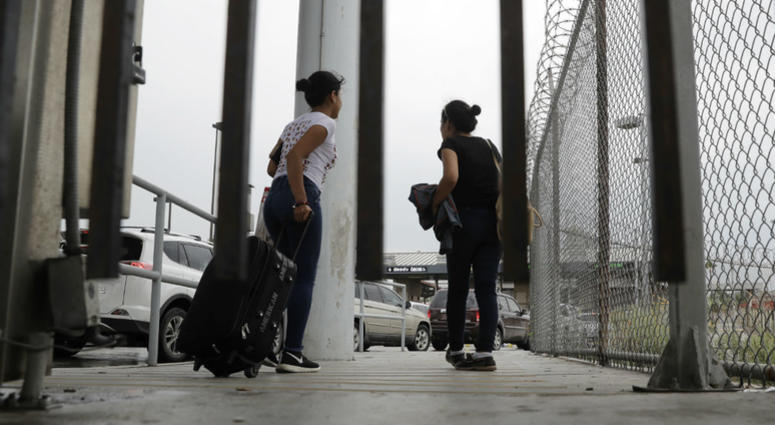 In this June 20, 2018, file photo, sisters from Guatemala seeking asylum, cross a bridge to a port of entry in to the United States from Matamoros, Mexico, in Brownsville, Texas. In this June 20, 2018, file photo, sisters from Guatemala seeking asylum, cross a bridge to a port of entry in to the United States from Matamoros, Mexico, in Brownsville, Texas.