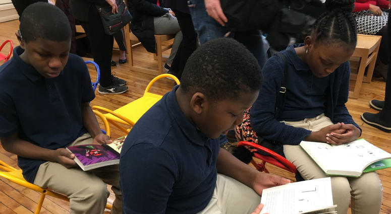 Students read at the re-opened library at Bache-Martin Elementary in Fairmount. Students read at the re-opened library at Bache-Martin Elementary in Fairmount.