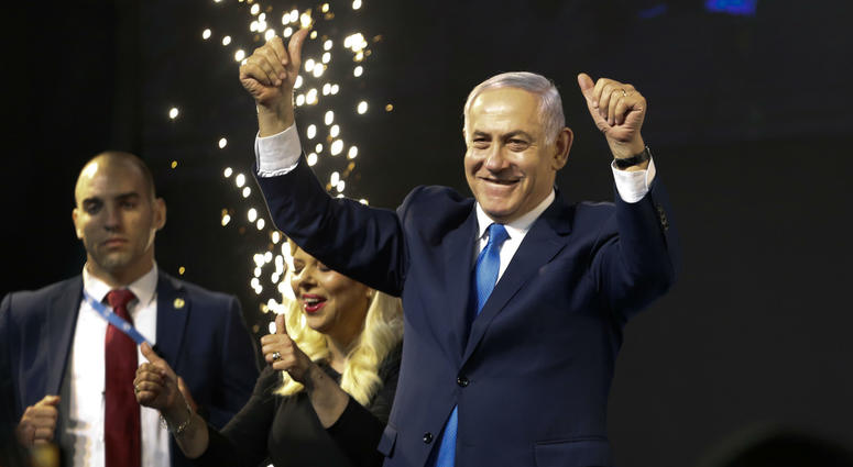 Israel's Prime Minister Benjamin Netanyahu waves to his supporters after polls for Israel's general elections closed in Tel Aviv, Israel, Wednesday, April 10, 2019. Israel's Prime Minister Benjamin Netanyahu waves to his supporters after polls for Israel's general elections closed in Tel Aviv, Israel, Wednesday, April 10, 2019.